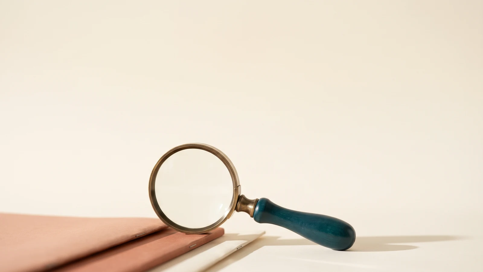 A magnifier resting on an itemized hospital bill